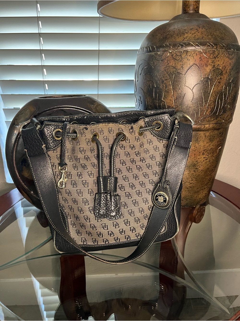 Dooney & Bourke Brown and Black DB Logo Drawstring Bucket Bag